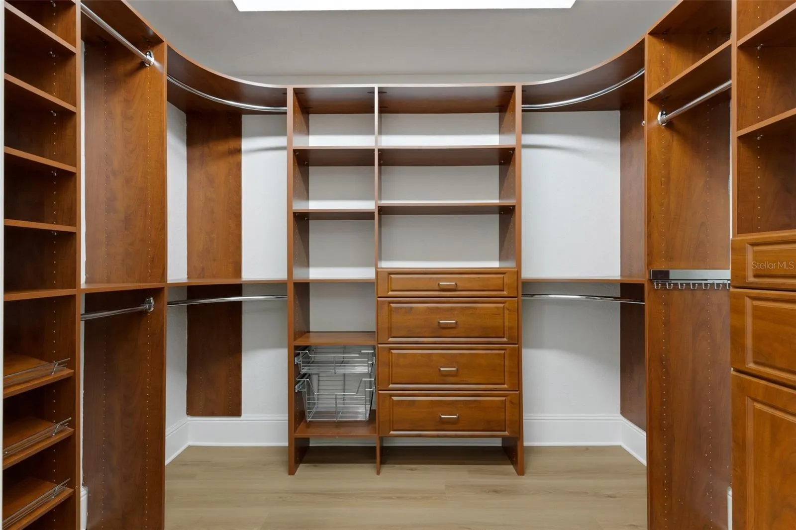 And the two oversized closets and outfitted with custom organizer systems . . .