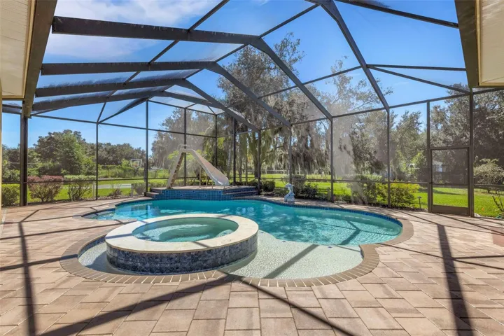 The oversized pool area has it all  . . .