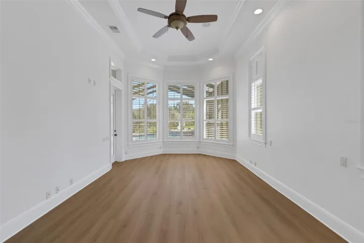 designed for a sitting area that overlooks the pool and backyard beyond.