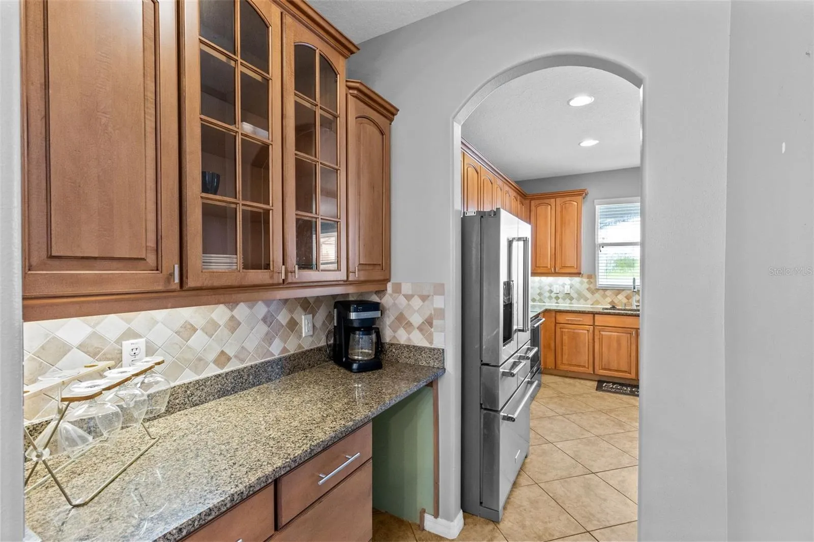 A butler’s pantry is conveniently positioned between the kitchen and formal dining room.