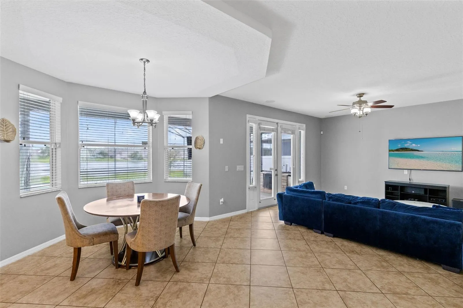 Living room with pool and pond views.