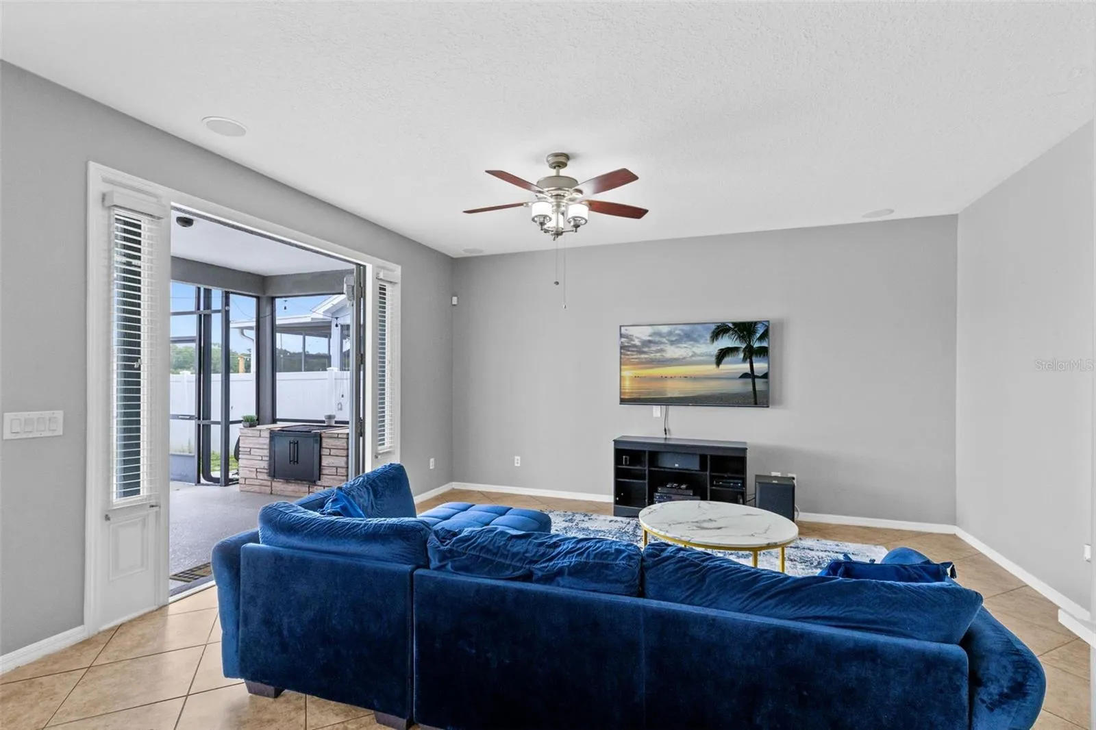Living room with pool and pond views.