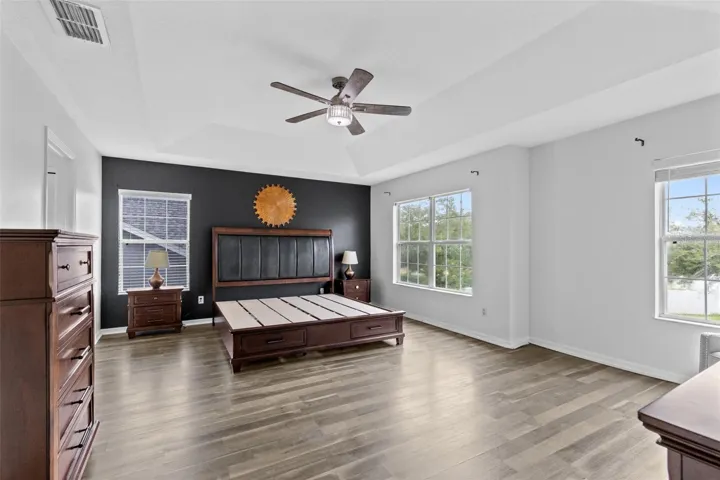 The generous primary suite features a tray ceiling and walk in closet.