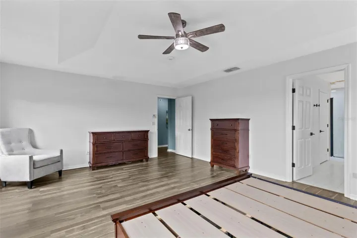 The generous primary suite features a tray ceiling and walk in closet.