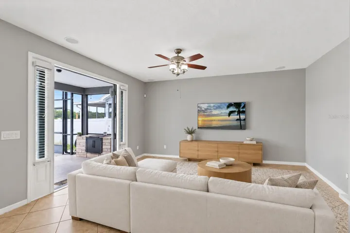 Living room with pool and pond view.