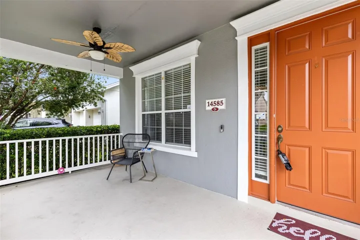 A covered front porch welcomes you into the foyer, where the formal living and dining rooms are positioned together just inside the entrance.