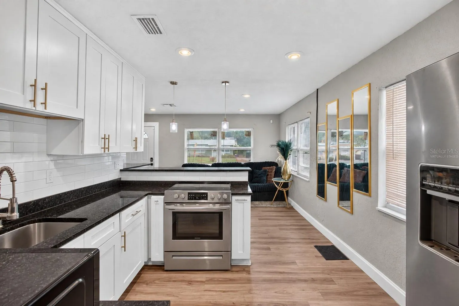 Virtually Staged. Personal Items digitally removed. Open Kitchen with breakfast bar