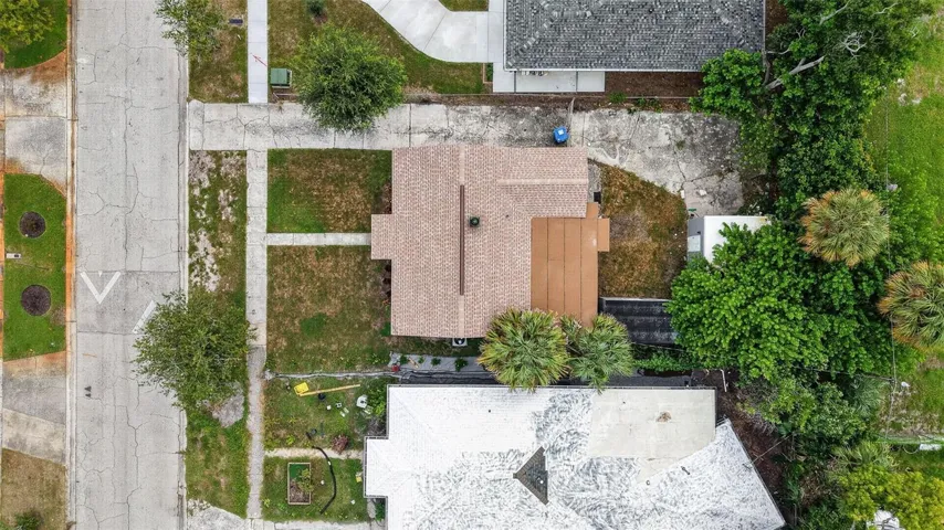 Overhead aerial view of property and surrounding area