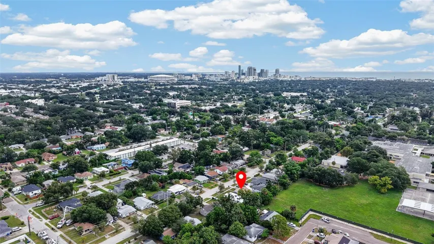 Aerial view of property and surrounding neighborhood the property location is marked with a red pin