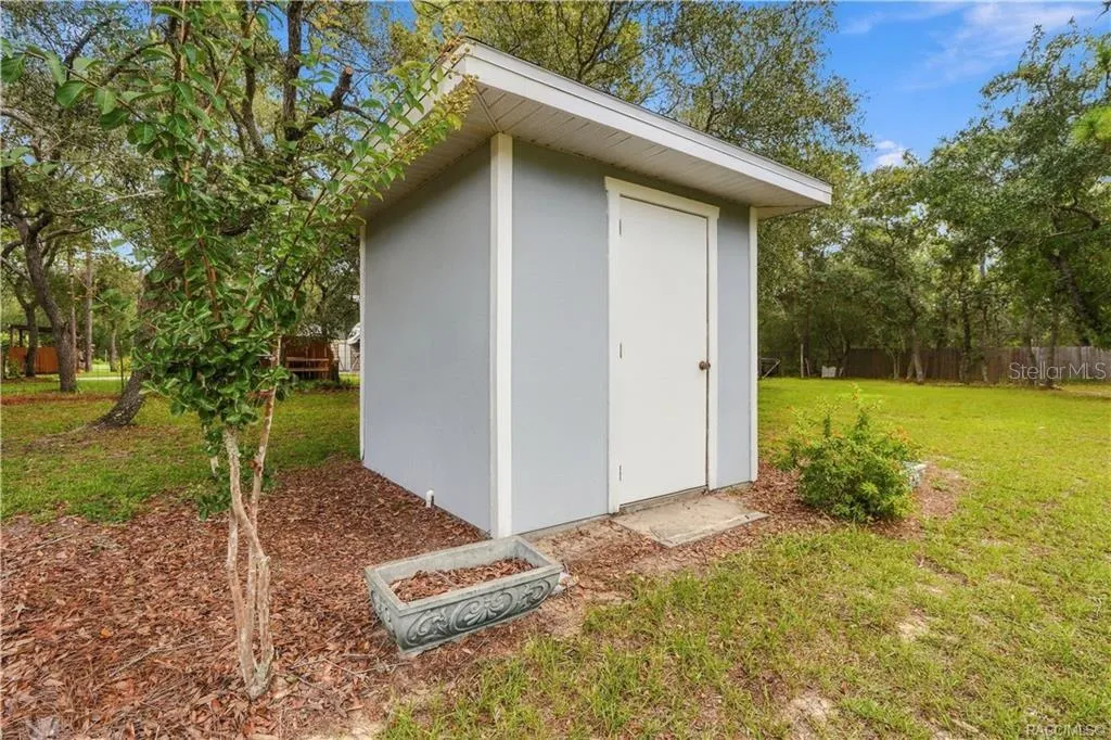 DEDICATED WELL HOUSE – Separate well house provides protected space for the property’s well equipment while keeping it conveniently accessible.