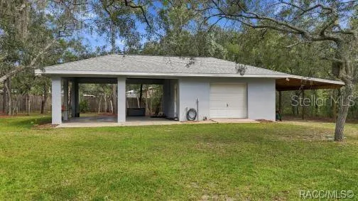 Detached 20 x20 Garage/Outbuilding/Workshop PLUS 2 Carports w/a Concrete Slab &amp; a POLE BARN – Separate detached garage/outbuilding offering additional covered space, storage &amp; plenty of possibilities.