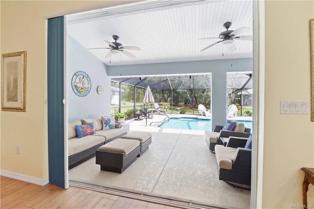Covered Lanai – Large covered outdoor living area opening directly from the home and overlooking the screened pool. Great for entertaining.