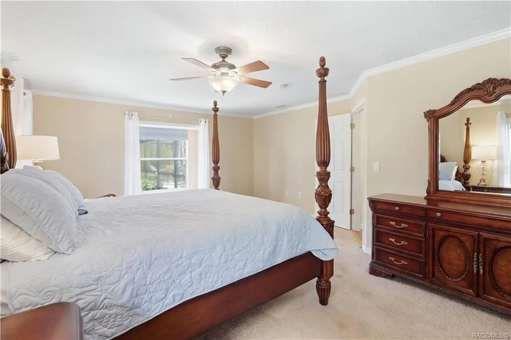 Primary Bedroom – Alternate view highlighting the generous size, natural light and crown molding.