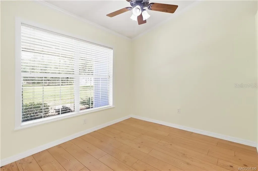 Flex Room / Office 4th Bedroom – Bright additional room with laminate flooring, crown molding, ceiling fan and large window; ideal for an office, den or potential 4th bedroom.