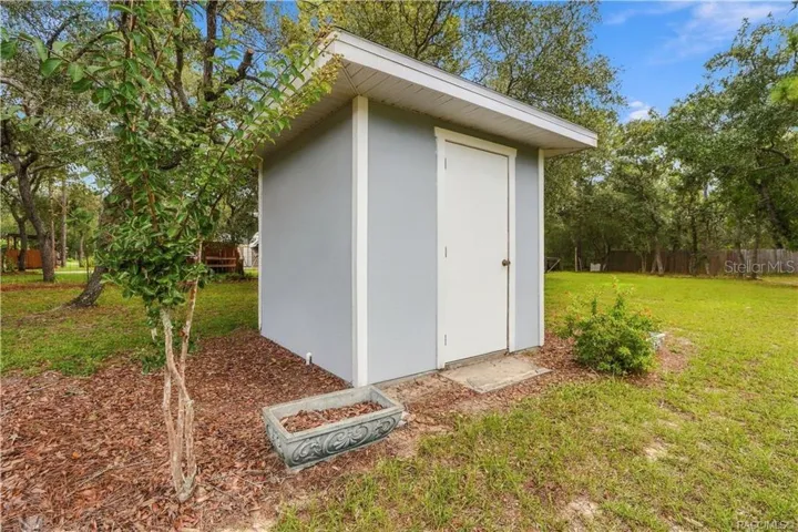 DEDICATED WELL HOUSE – Separate well house provides protected space for the property’s well equipment while keeping it conveniently accessible.