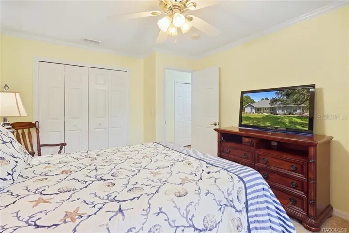 Guest Bedroom – Alternate view showing ample closet space and room for additional furnishings.