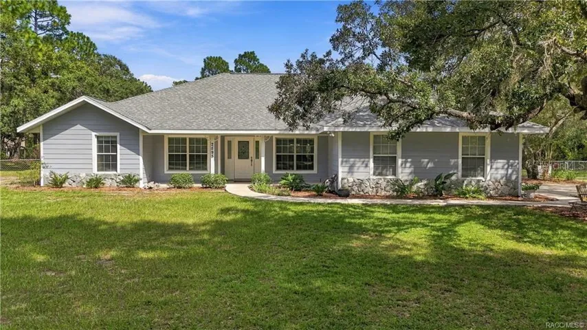 WELCOME HOME!!! CLASSIC CURB APPEAL – Attractive front elevation framed by mature landscaping and sitting on 1.25 fully fenced yard.
