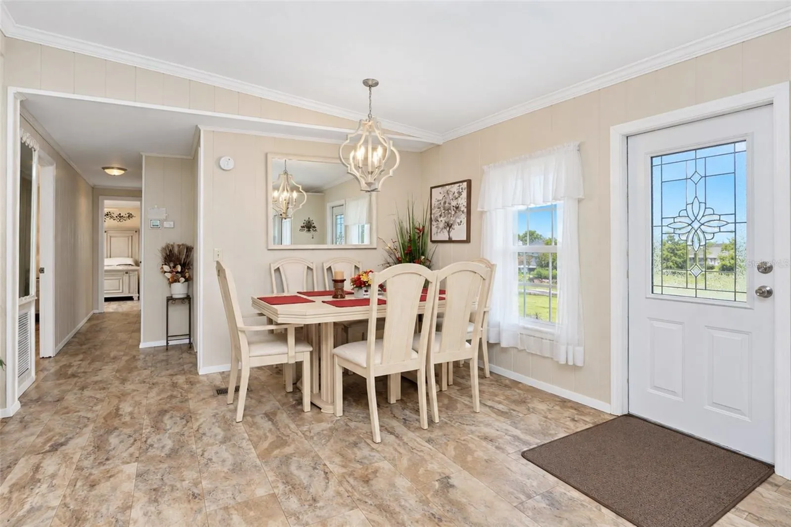 The dining area features updated lighting and natural light.