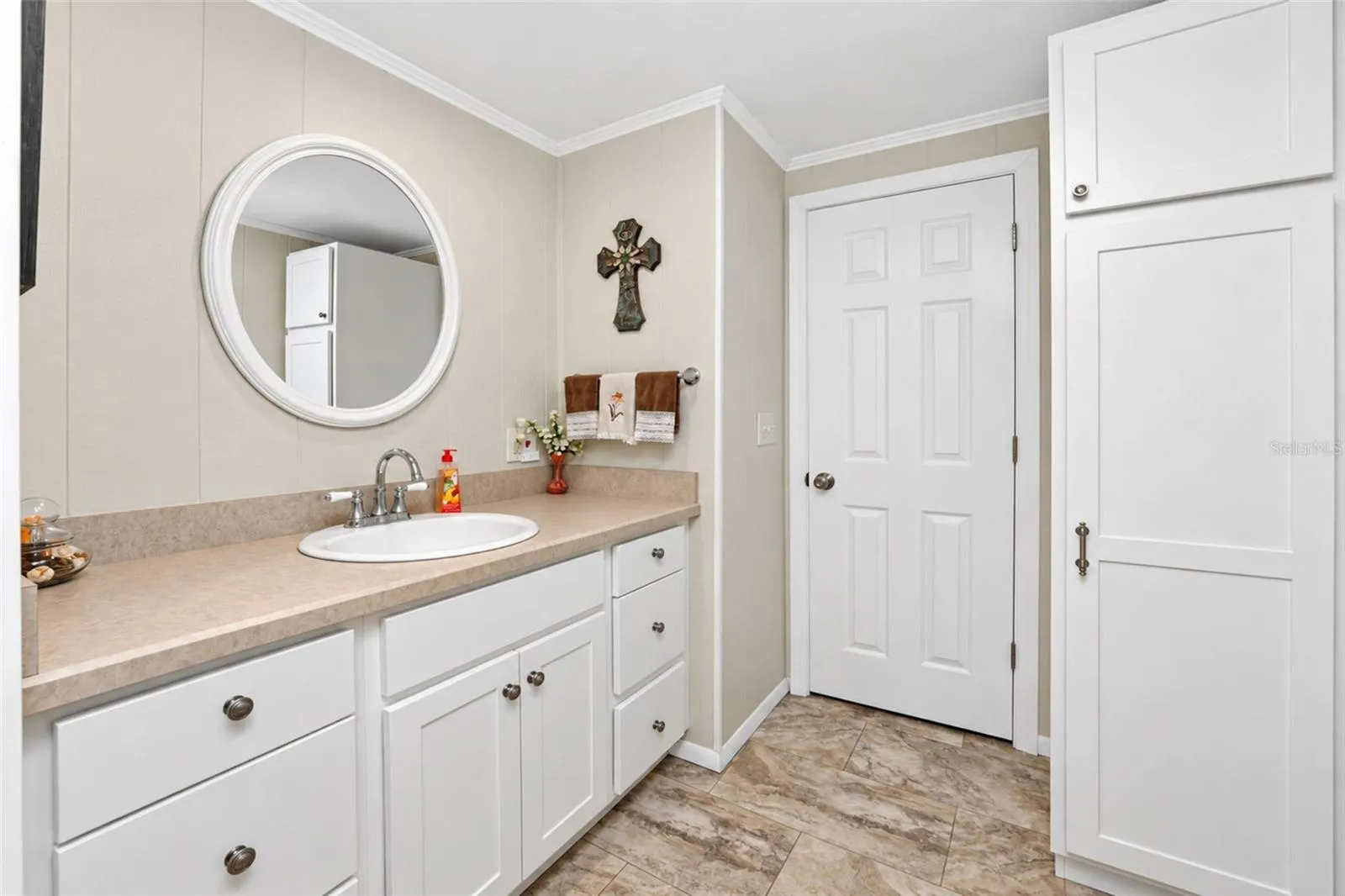 The guest bathroom includes a new vanity, along with excess built in storage.
