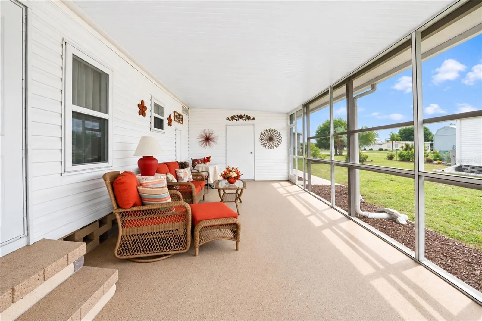 The screened lanai features durable Gorilla Garage floor coating.