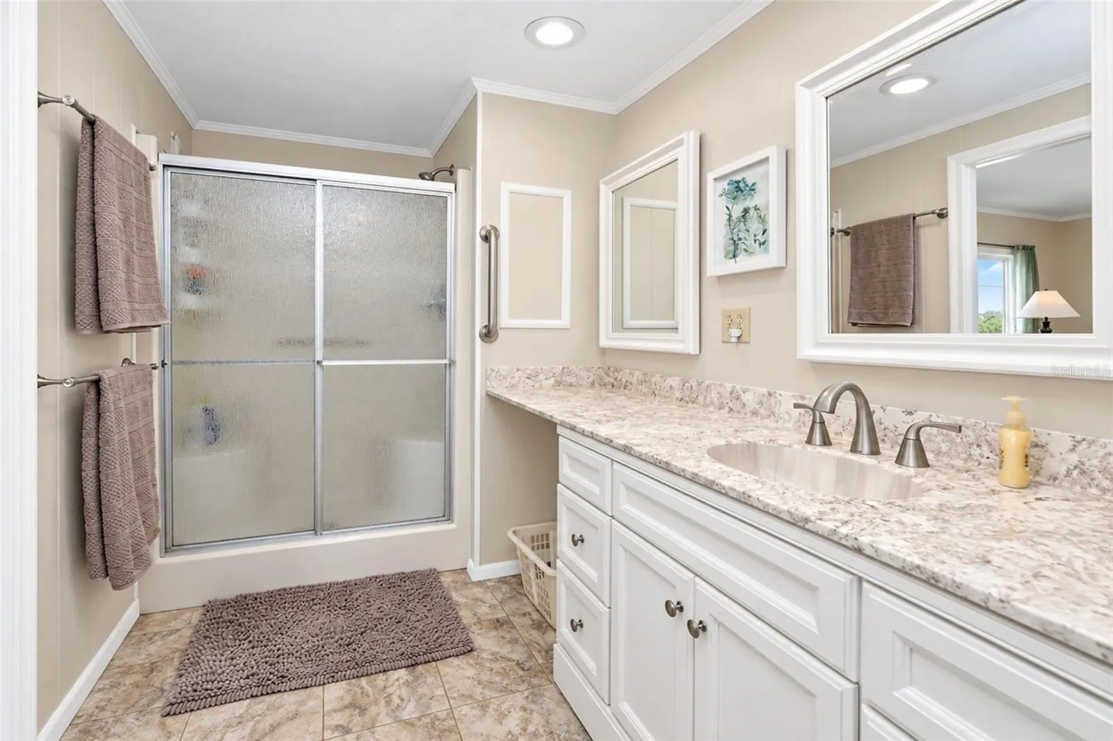 The step in shower has a seat for convenience!
