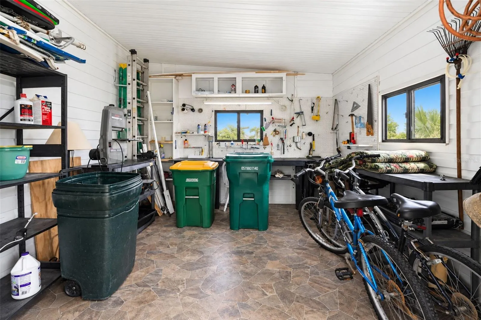 The shed/workshop is adjacent to the lanai and provides plenty of storage.
