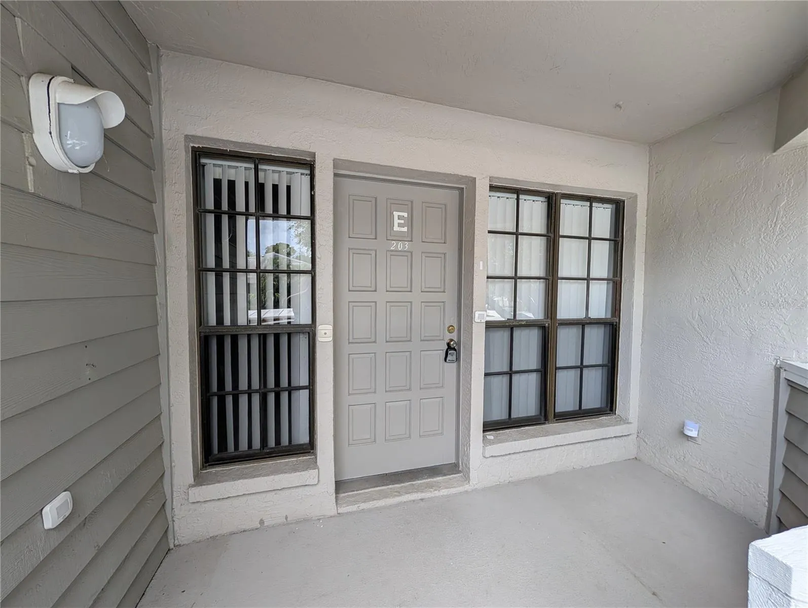 Entry door and landing pad
