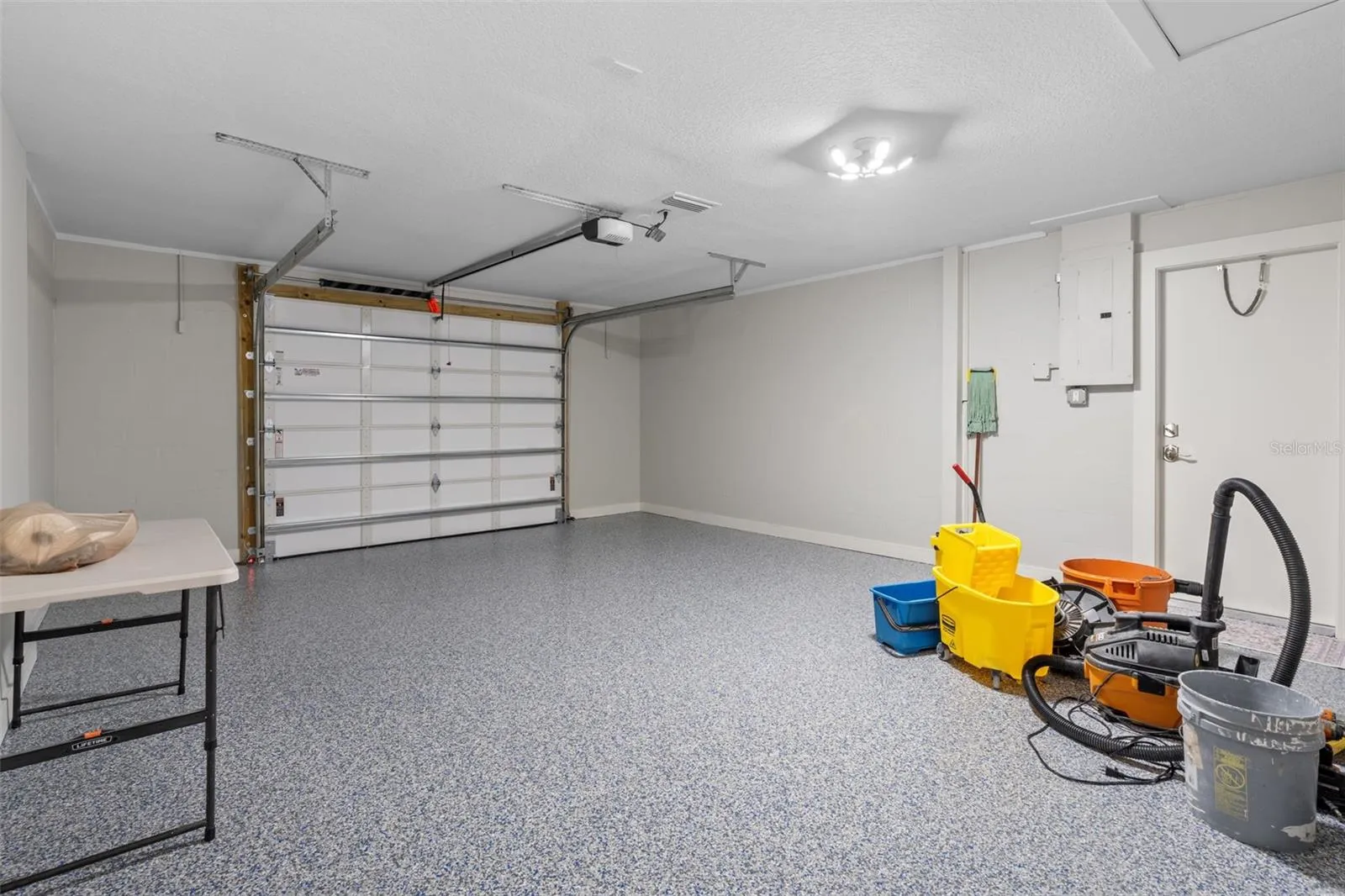 Garage with BRAND NEW epoxy flooring