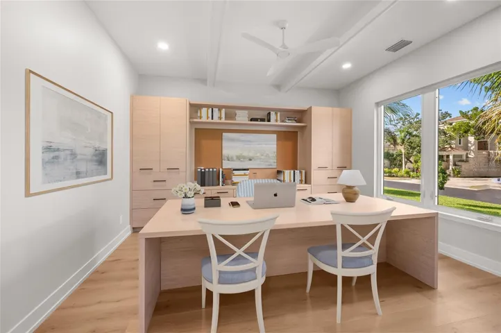 Virtually staged, first floor built in office.