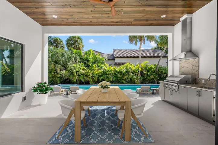 Virtually staged, paradise awaits in the under roof outdoor entertaining area with built in luxury kitchen.