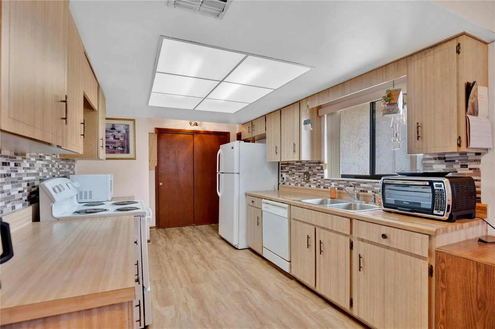 Kitchen looking towards garage door