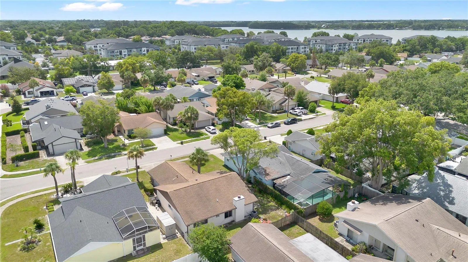 Elevated view from behind the home with Lake Howell off in the distance