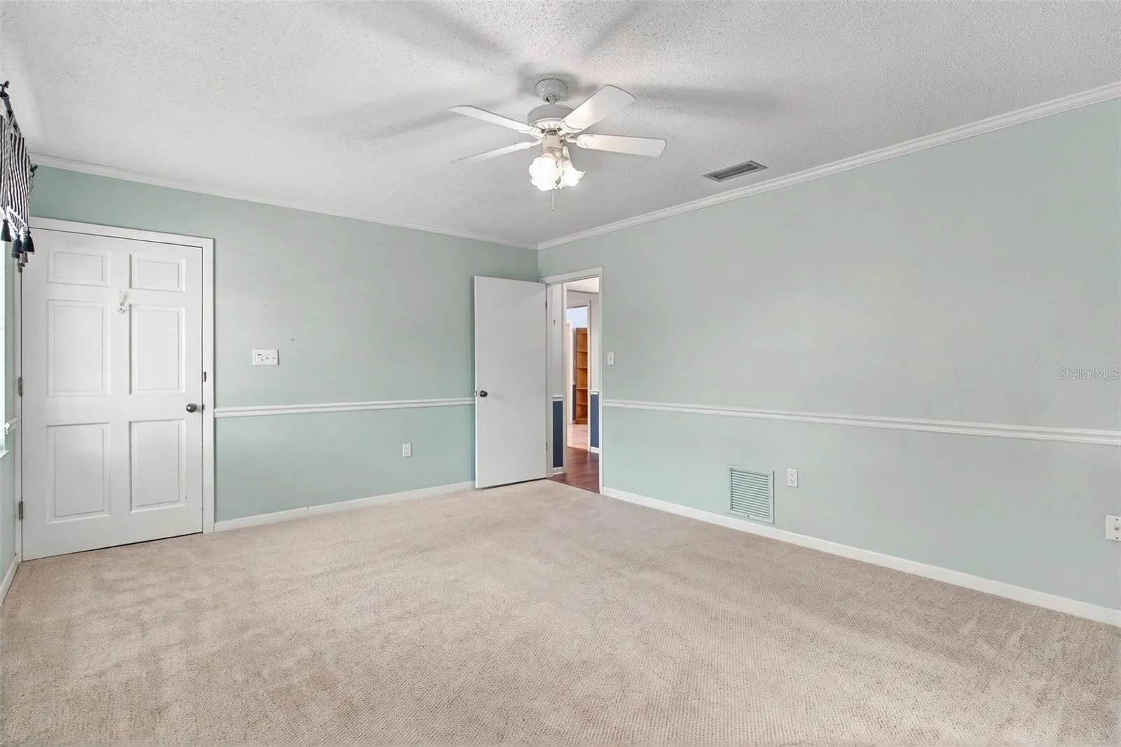 Spacious primary bedroom with walk-in closet