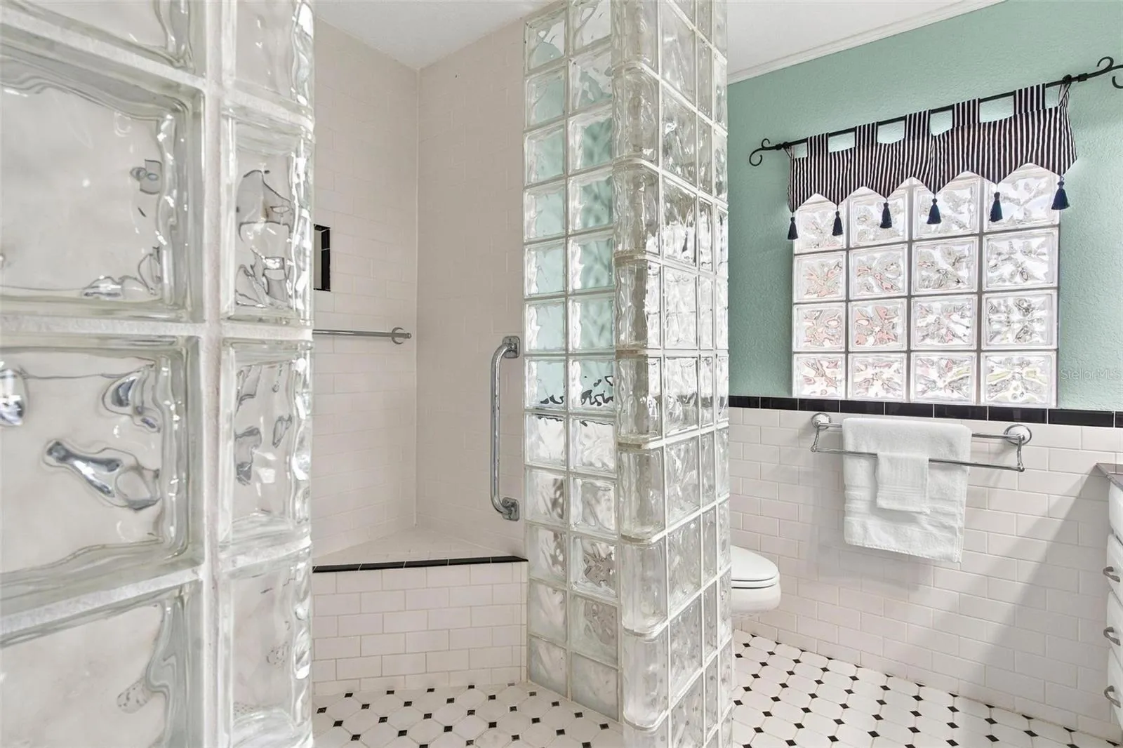 Primary bathroom with wheelchair-accessible shower