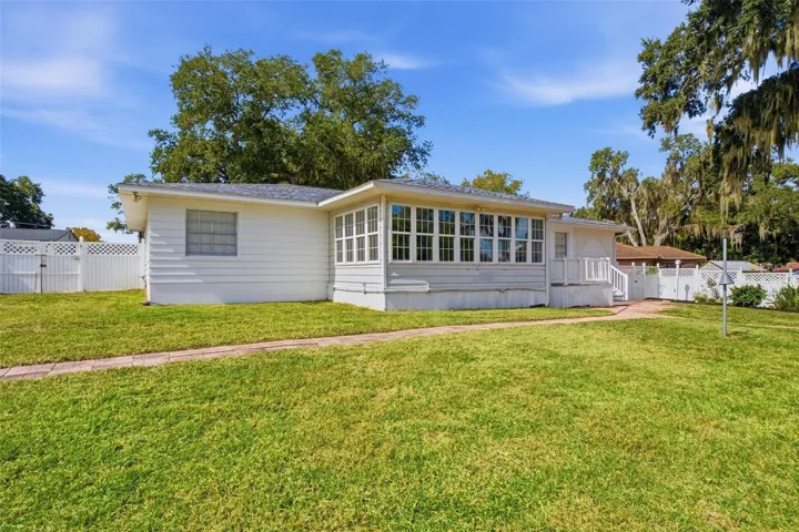 Rear exterior with spacious backyard
