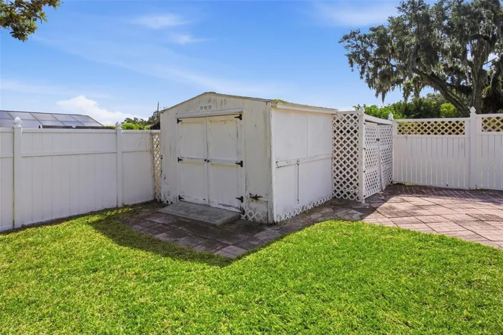 Fully fenced backyard with 2 storage sheds