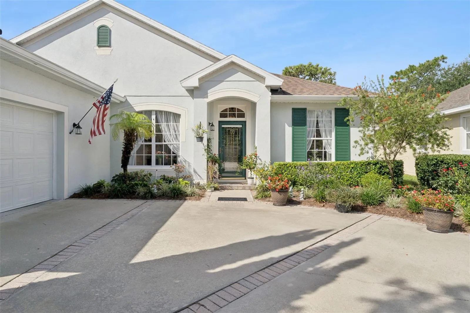 Exterior front of the home w/ a leaded glass front door &amp; storm door