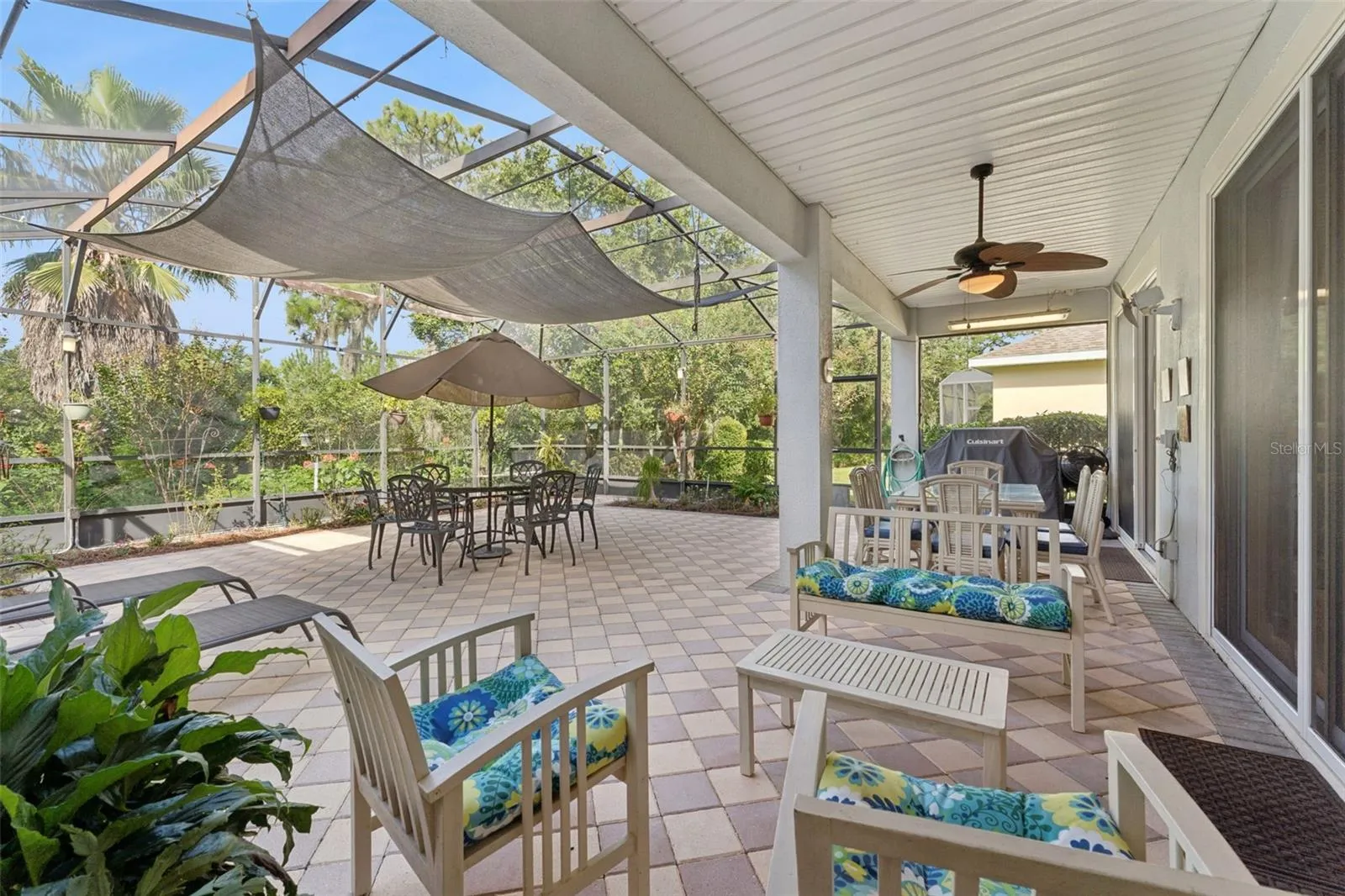 View of the Conservation area behind the home from the screen enclosed covered patio
