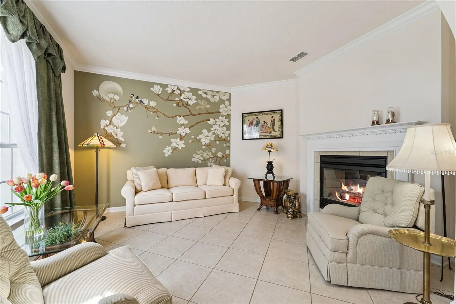 12' x 14' Living Room w/ crown molding, accent wall &amp; a double sided natural gas fireplace