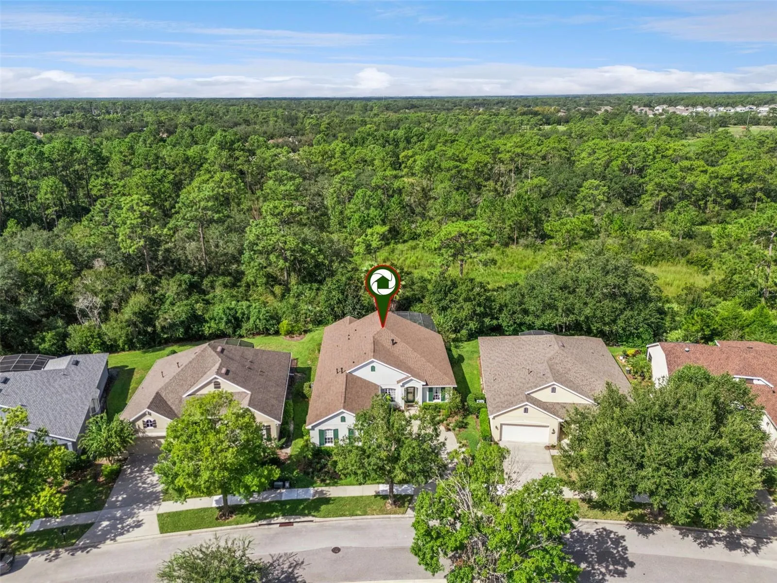 Aerial view of the home's location w/ a conservation area view