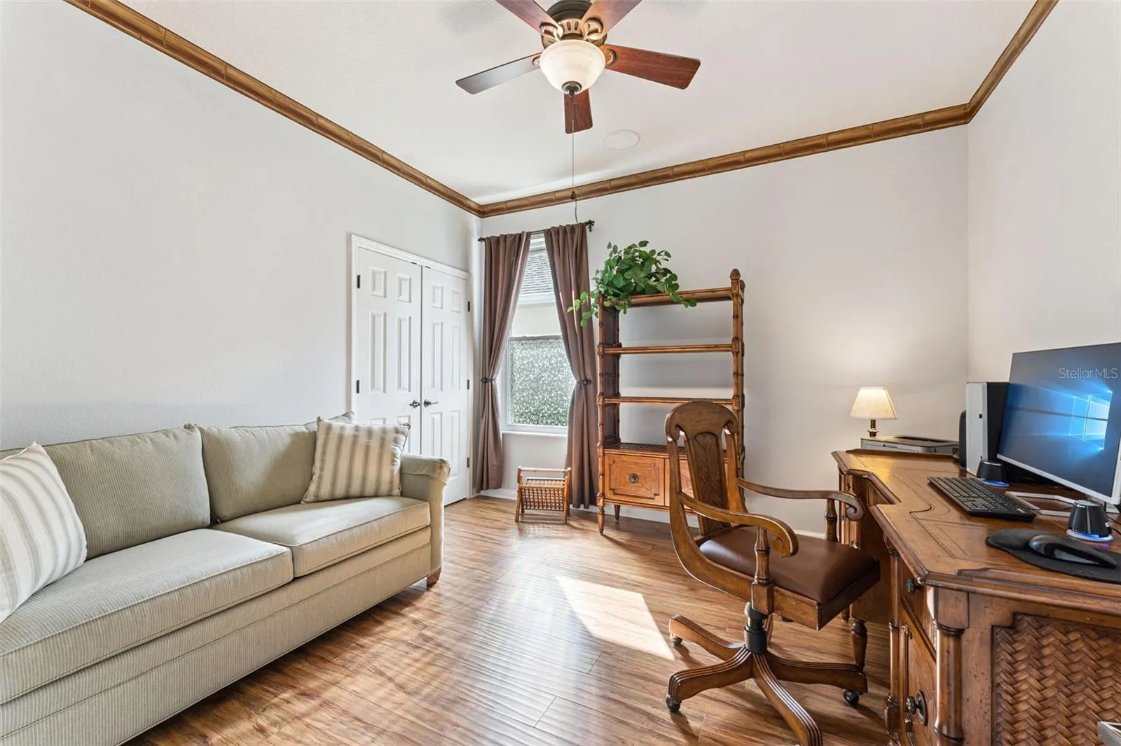 11'6" x 12' Bedroom #2 w/ engineered wood flooring, ceiling fan, surround sound speakers &amp; a double door entry