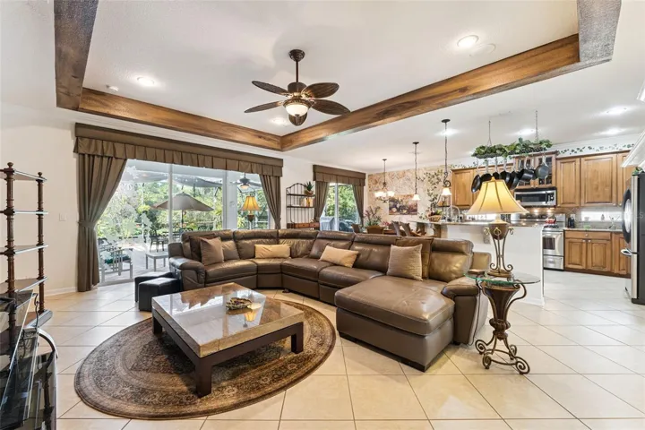 View of the 30' x 32' screen enclosed covered patio w/ brick pavers &amp; conservation area from the Family Room