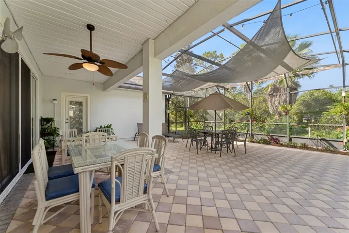 30' x 32' Screen enclosed covered patio w/ brick pavers, awning, ceiling fan &amp; lighting