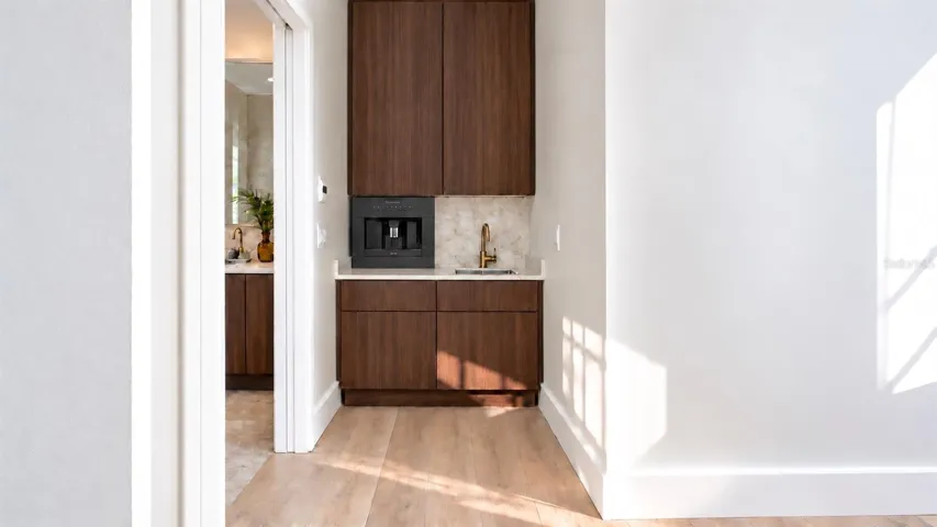 Wet bar for the primary bedroom, with virtual staging