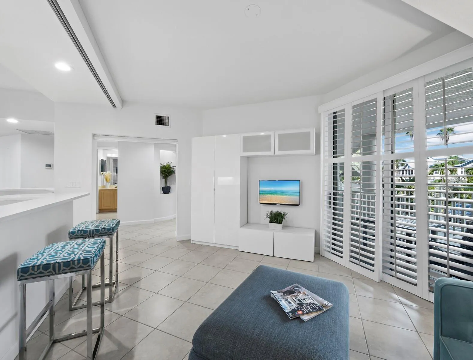 Family room with retractable privacy screen