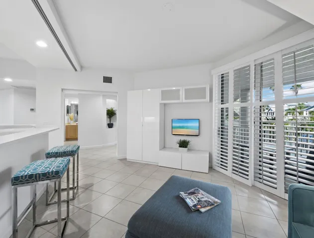 Family room with retractable privacy screen