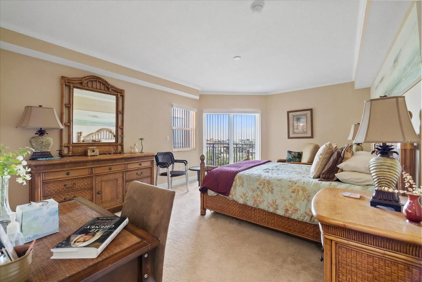 Primary bedroom with balcony sliders
