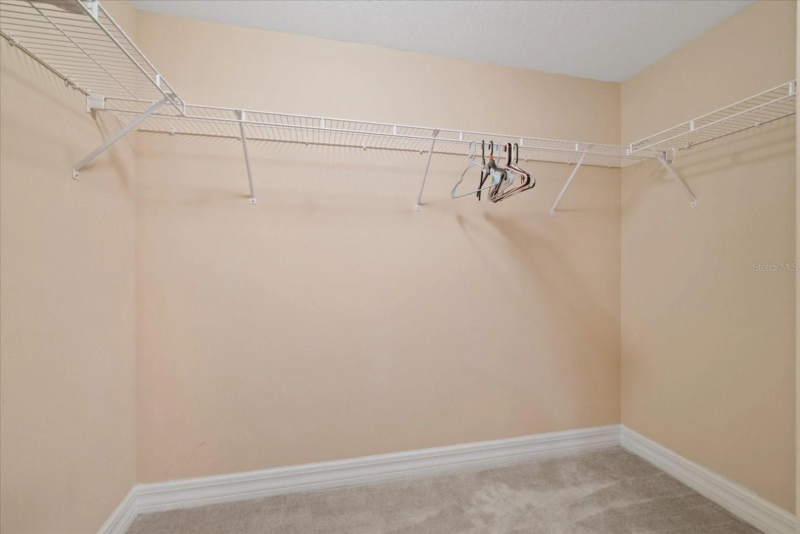 walk in primary bedroom closet