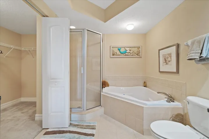 Garden tub and stand alone shower with walk in closet