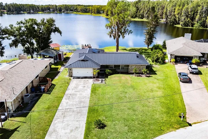 Long driveway with lush lawn